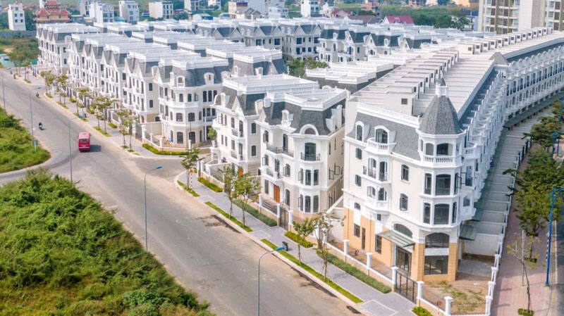 A picture containing outdoor, grass, building, city Description automatically generated